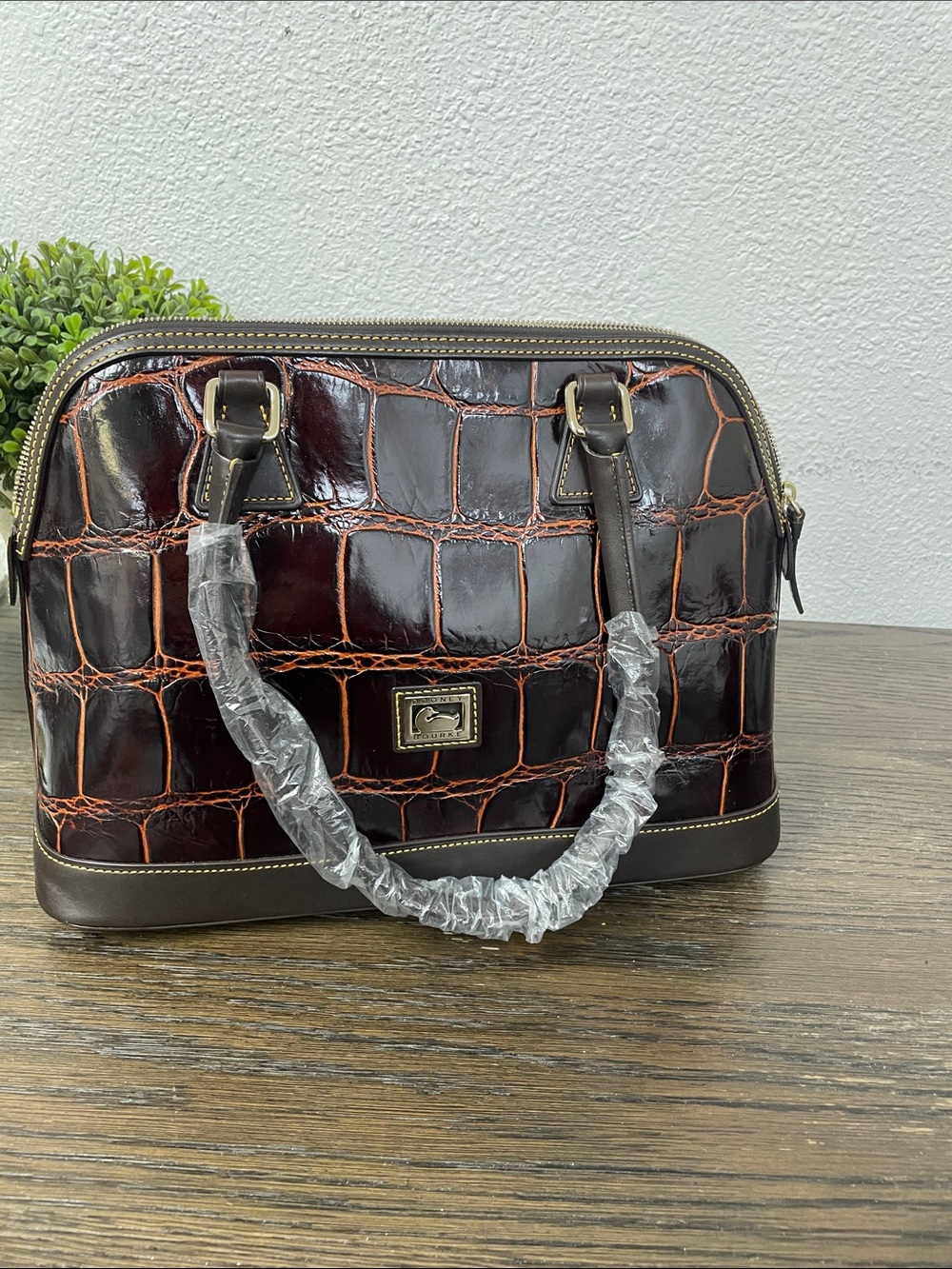 Dooney & Bourke cognc croco-embossed leather dome satchel.